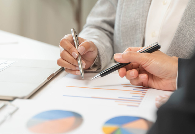 Business discussion with charts and graphs